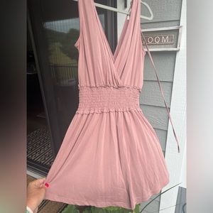 Rose/pinkish shorts romper. Size large ties at top in back.